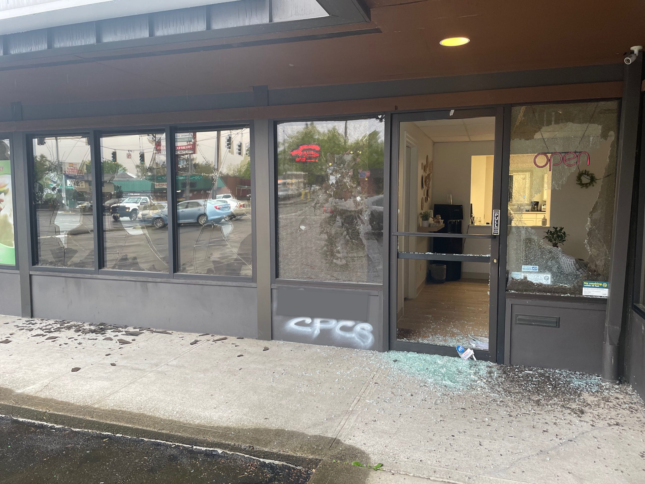 Photo of Southeast Center's shattered glass windows and door